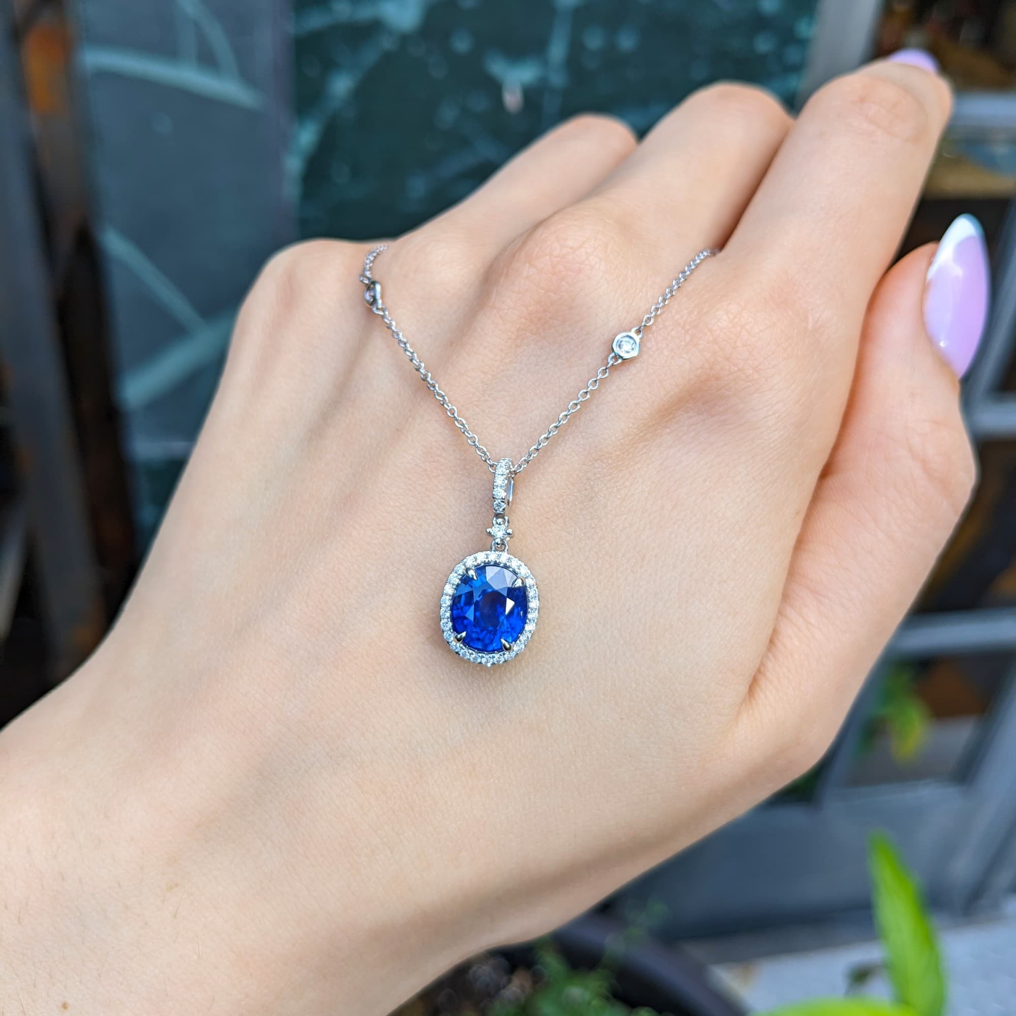 Shown in 18K White Gold with Blue Sapphire